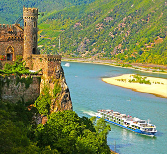 Avalon Waterways ship cruising past Rhine river castle