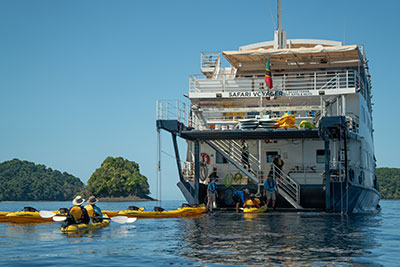 Guests kayaking along Baja California’s rugged coastline